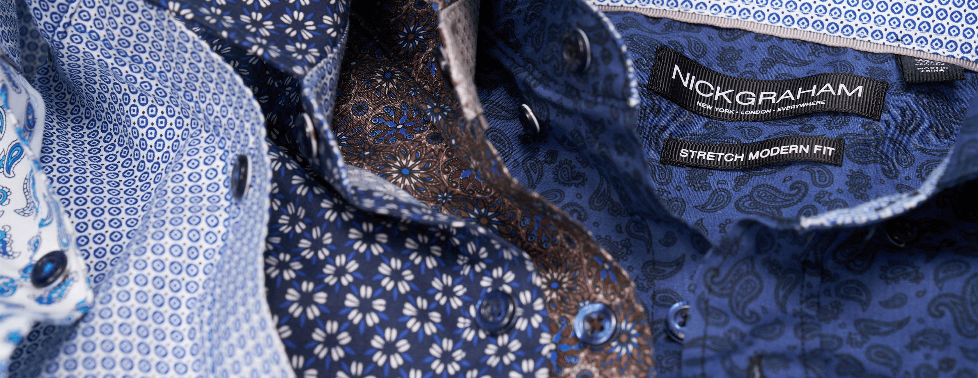 Close-up of a blue patterned shirt with 'Nick Graham' label